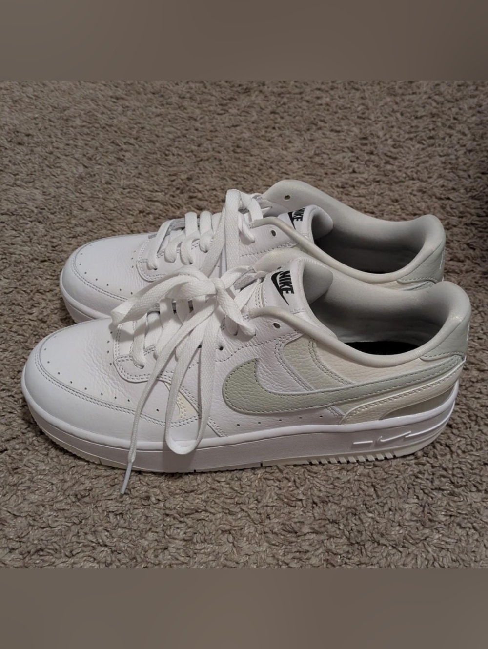 Nike White Low-Top Sneakers with Light Grey Swoosh